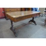 A William IV rosewood two drawer library table