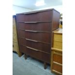 A teak chest of drawers