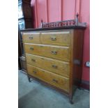A Victorian Aesthetic Movement walnut chest of drawers