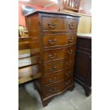 A mahogany serpentine chest of drawers