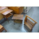 Two teak magazine racks and an occasional table