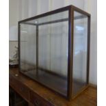 A mahogany and perspex display case