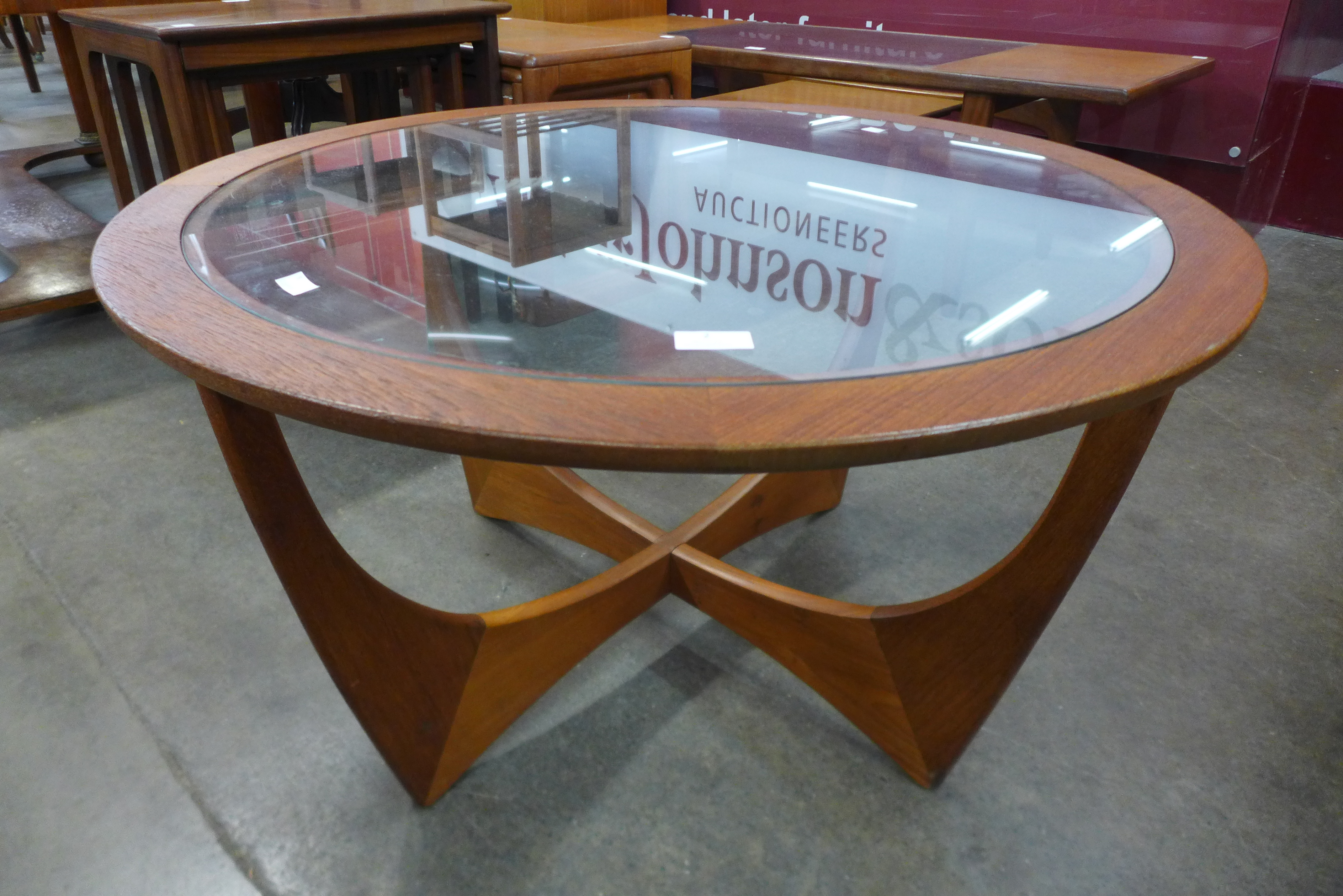 A G-Plan Astro teak and glass topped circular coffee table