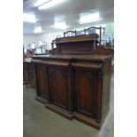 A William IV rosewood breakfront three door sideboard