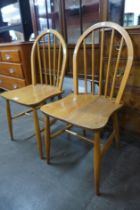 A pair of Ercol Blonde elm and beech Windsor chairs