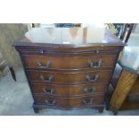 A mahogany serpentine faux chest cocktail cabinet