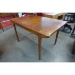 A McIntosh teak extending dining table