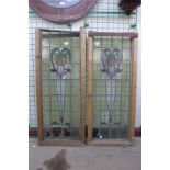 A pair of Art Nouveau stained glass windows, a/f