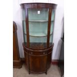 A mahogany demi lune side cabinet