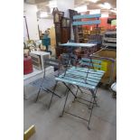 An aluminium and painted wooden garden table and four chairs