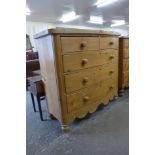 A Victorian pine bow front chest of drawers
