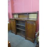 A Victorian Aesthetic Movement walnut breakfront bookcase