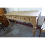 A Victorian style pine three drawer serving table