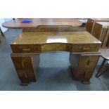 An Art Deco figured walnut desk