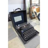 A vintage cased Remington Victor S Portable typewriter