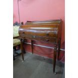 A George IV style mahogany lady's cylinder desk, manner of Gillows