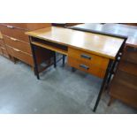 A Danish teak and black metal leg desk