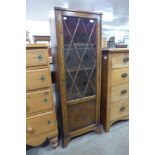 An early 20th Century oak single door bookcase