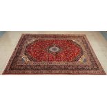 A large Persian Kashan red ground rug, 349 x 249cms