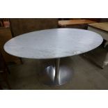 A chrome and marble topped oval dining table