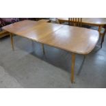 An Ercol elm and beech extending Grand Windsor dining table