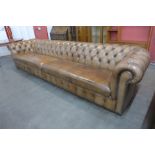 An extremely large Regency style tan leather Chesterfield settee, 73cms h, 340cms w, 96cms d