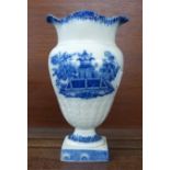 An early 19th Century pearlware vase, blue and white with oriental scene, some a/f, 19.5cm
