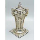 A white metal Corinthian column candlestick, 11cm with stopper