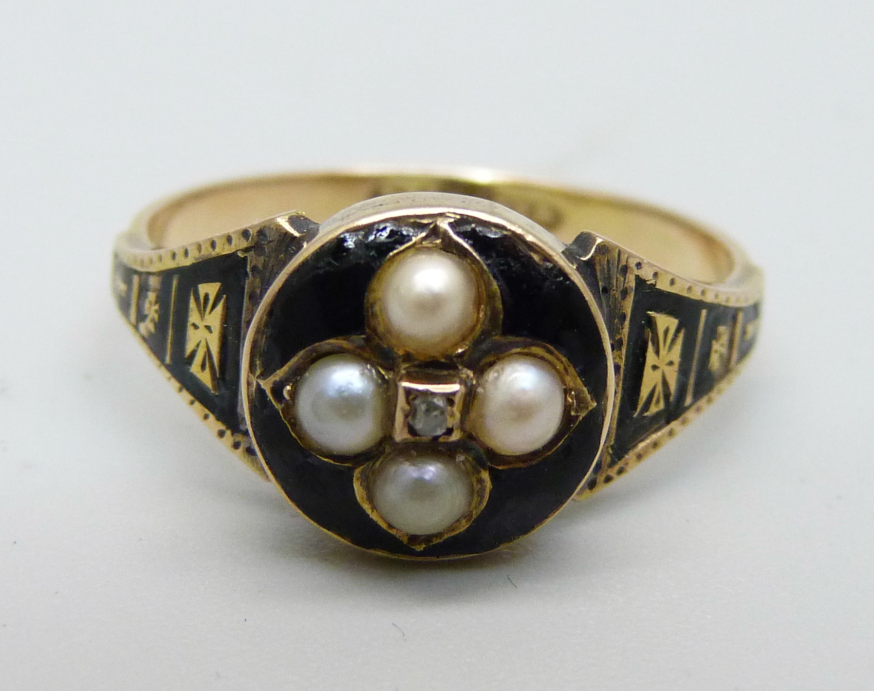 A 15ct gold, seed pearl, diamond and enamel mourning ring, 2.7g, O
