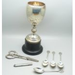 A silver trophy, silver handled grape scissors, silver coffee spoons and a silver pencil holder