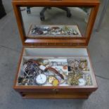 A jewellery box and costume jewellery with wristwatches