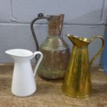 Three jugs; brass, copper and enamel including one marked JS&S