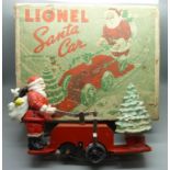 A Lionel Santa car with Mickey Mouse, one wheel loose, boxed