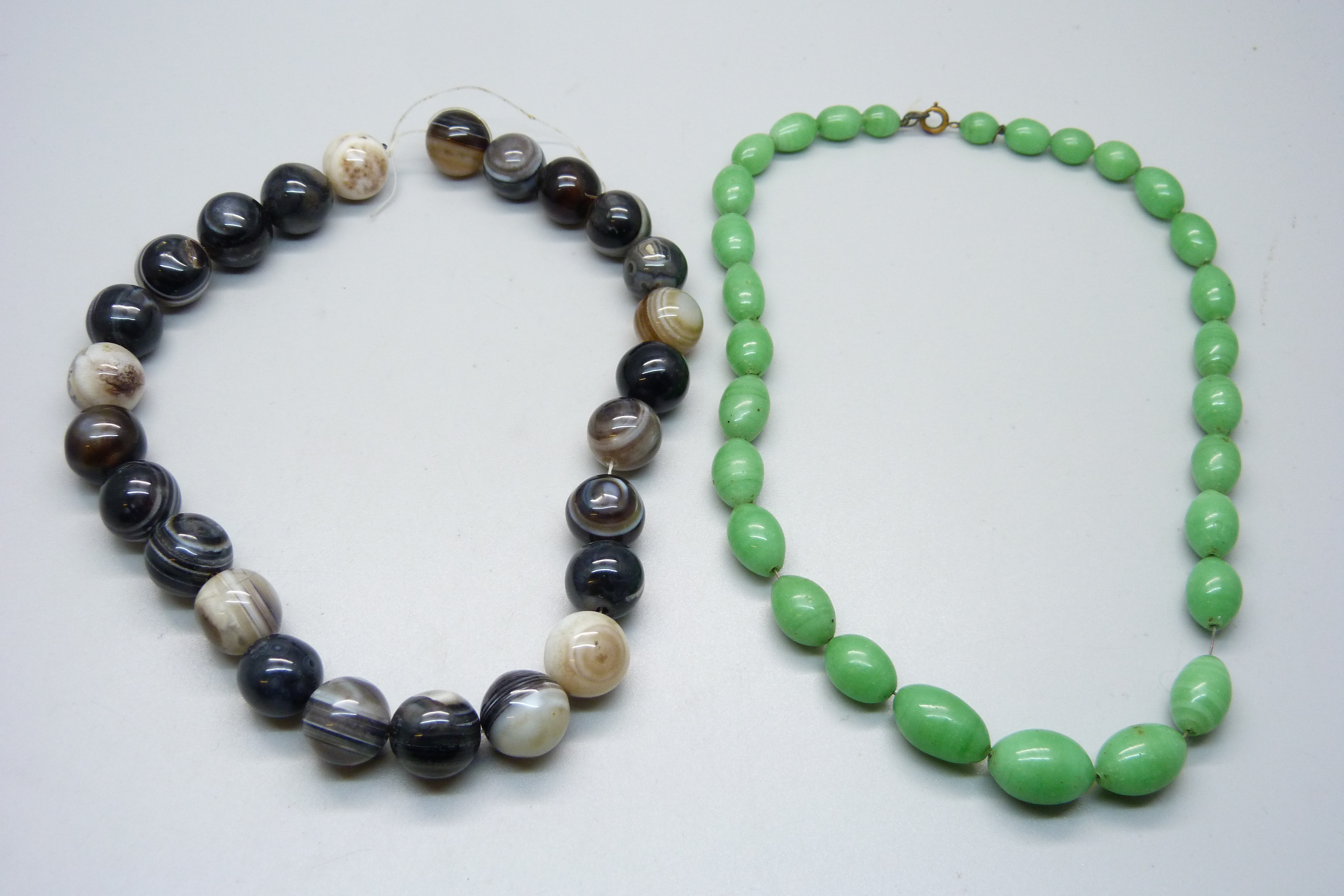 An agate bead necklace and a green bead necklet