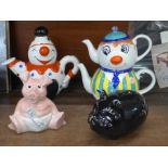 A black ceramic pig moneybank, two Price Kensington hand painted teapots and a Natwest pig moneybox,