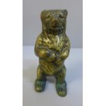 A brass grizzly bear money bank, 14.5cm