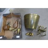 A copper shot flask and other copper and brassware