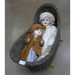 Two Edwardian dolls and a basket **PLEASE NOTE THIS LOT IS NOT ELIGIBLE FOR POSTING AND PACKING**