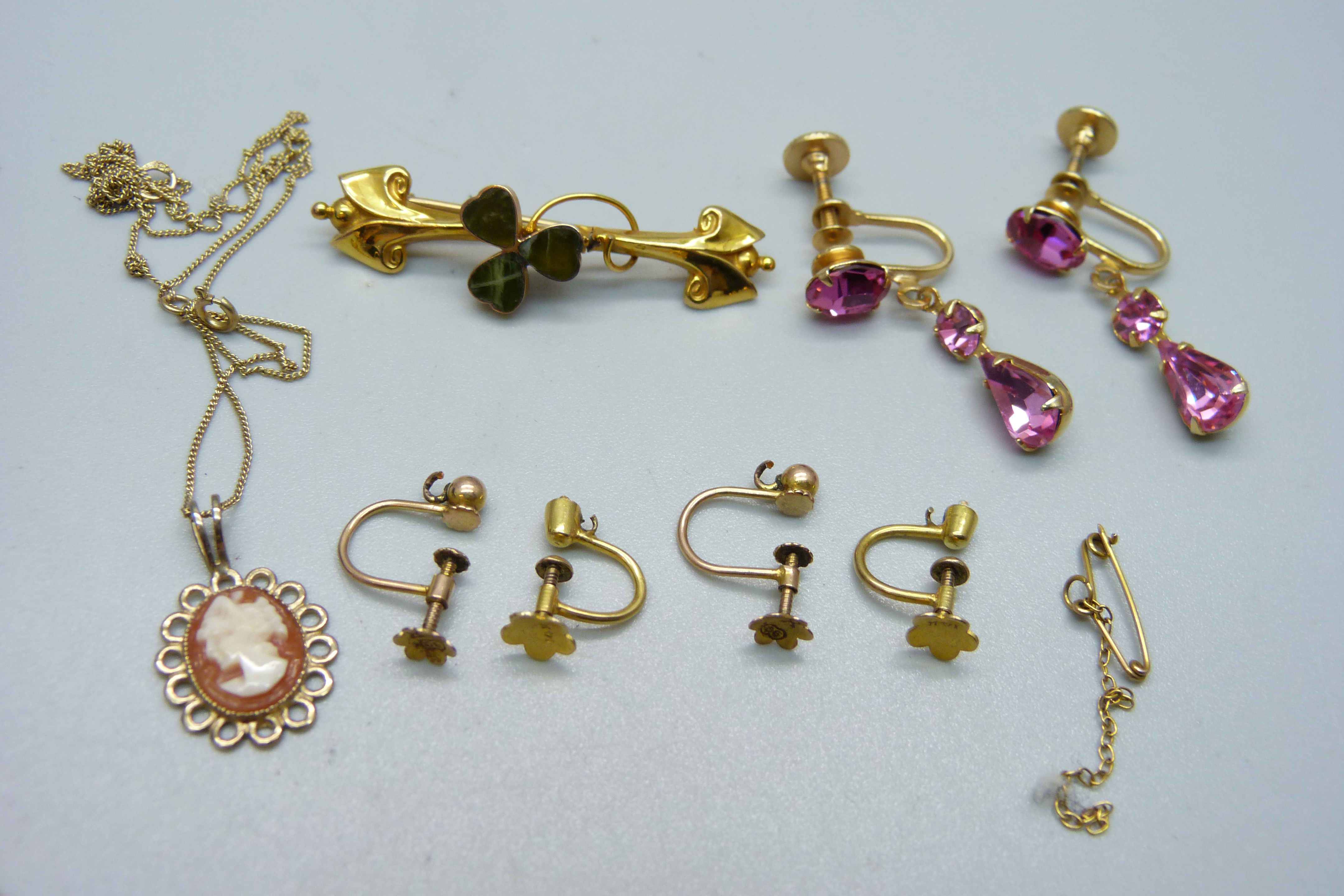 A 9ct gold shamrock brooch, a small ring marked 10K, a 9ct gold pendant and chain, a pair of 9ct - Image 2 of 5