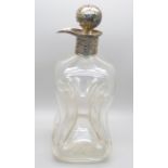 A silver topped glass glug glug decanter