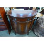 A mahogany demi-lune side cabinet