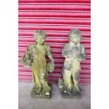 A pair of concrete garden figures