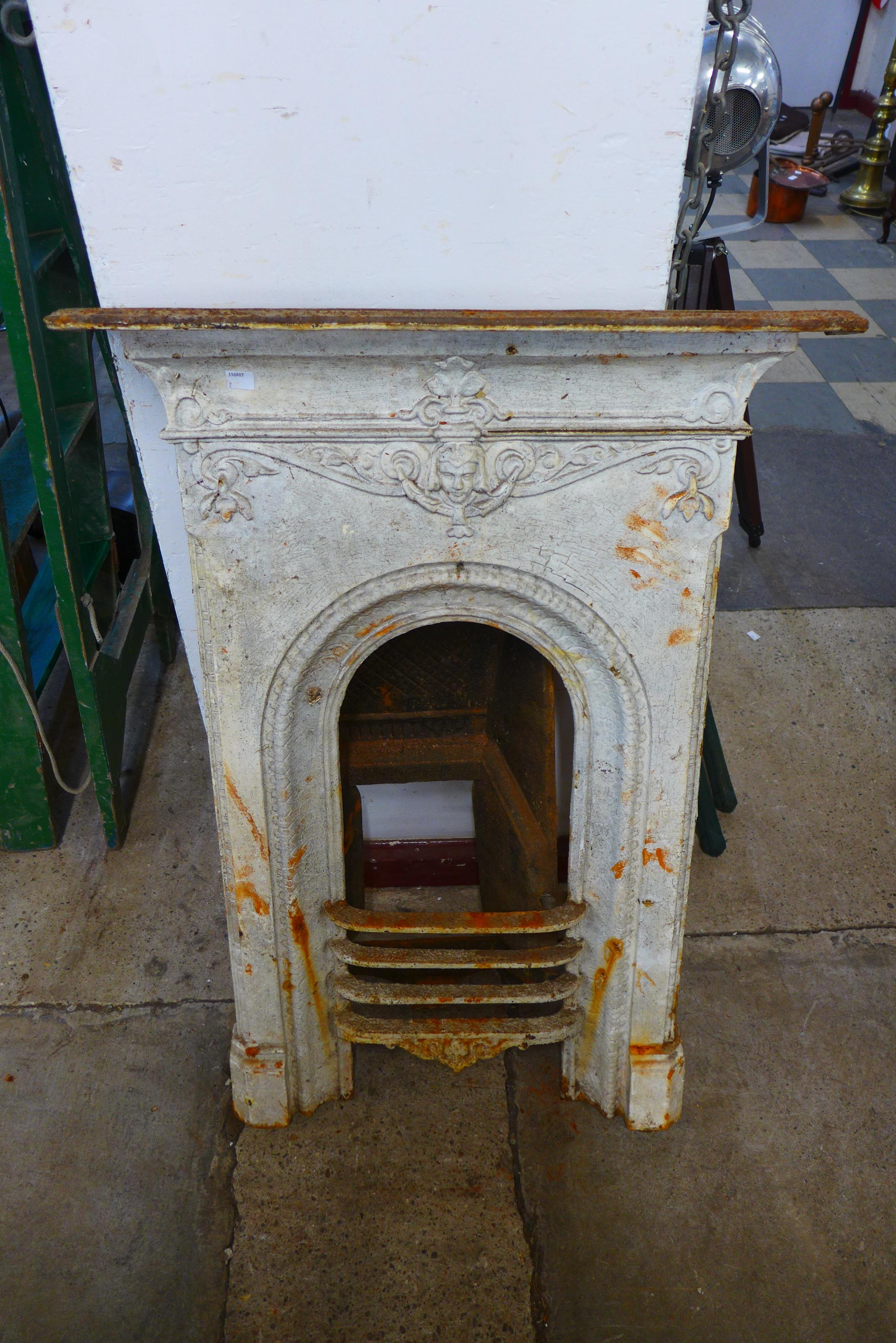 A Victorian cast iron fire surround