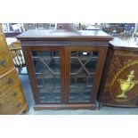 A George IV style mahogany two door bookcase