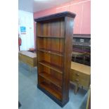 A tall Victorian mahogany open bookcase