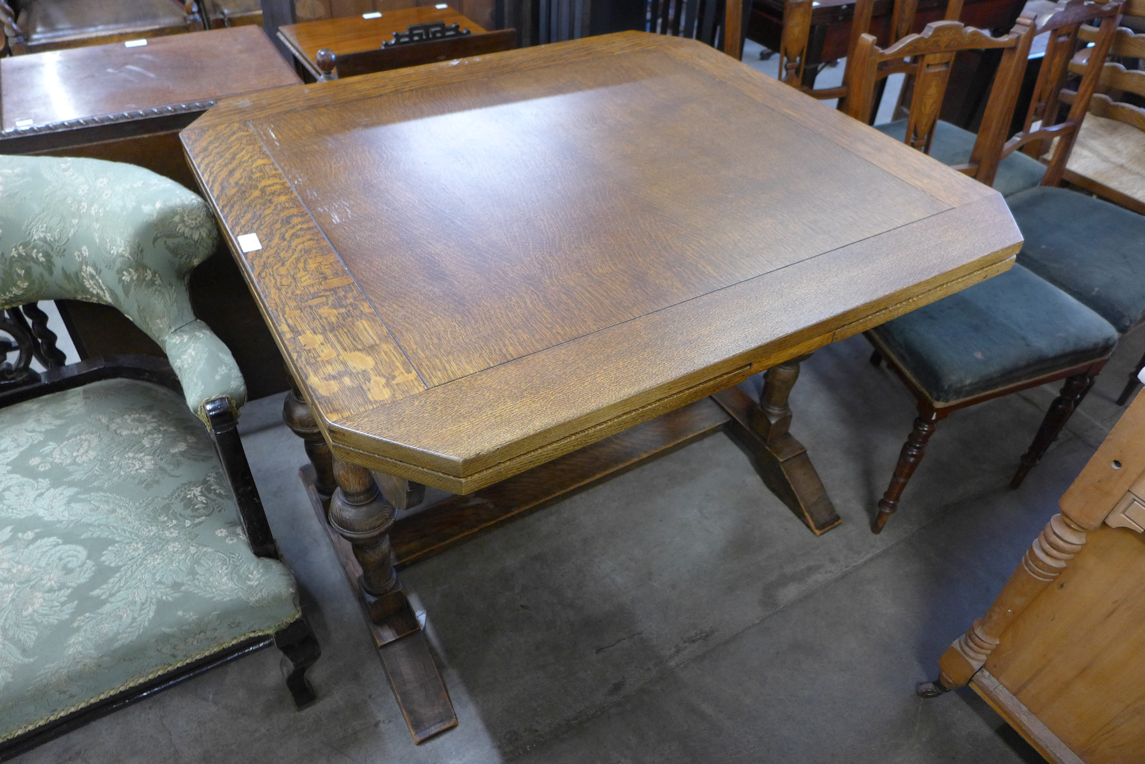 An oak draw-leaf table