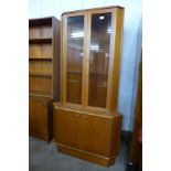 A Turnidge of London teak freestanding corner cabinet