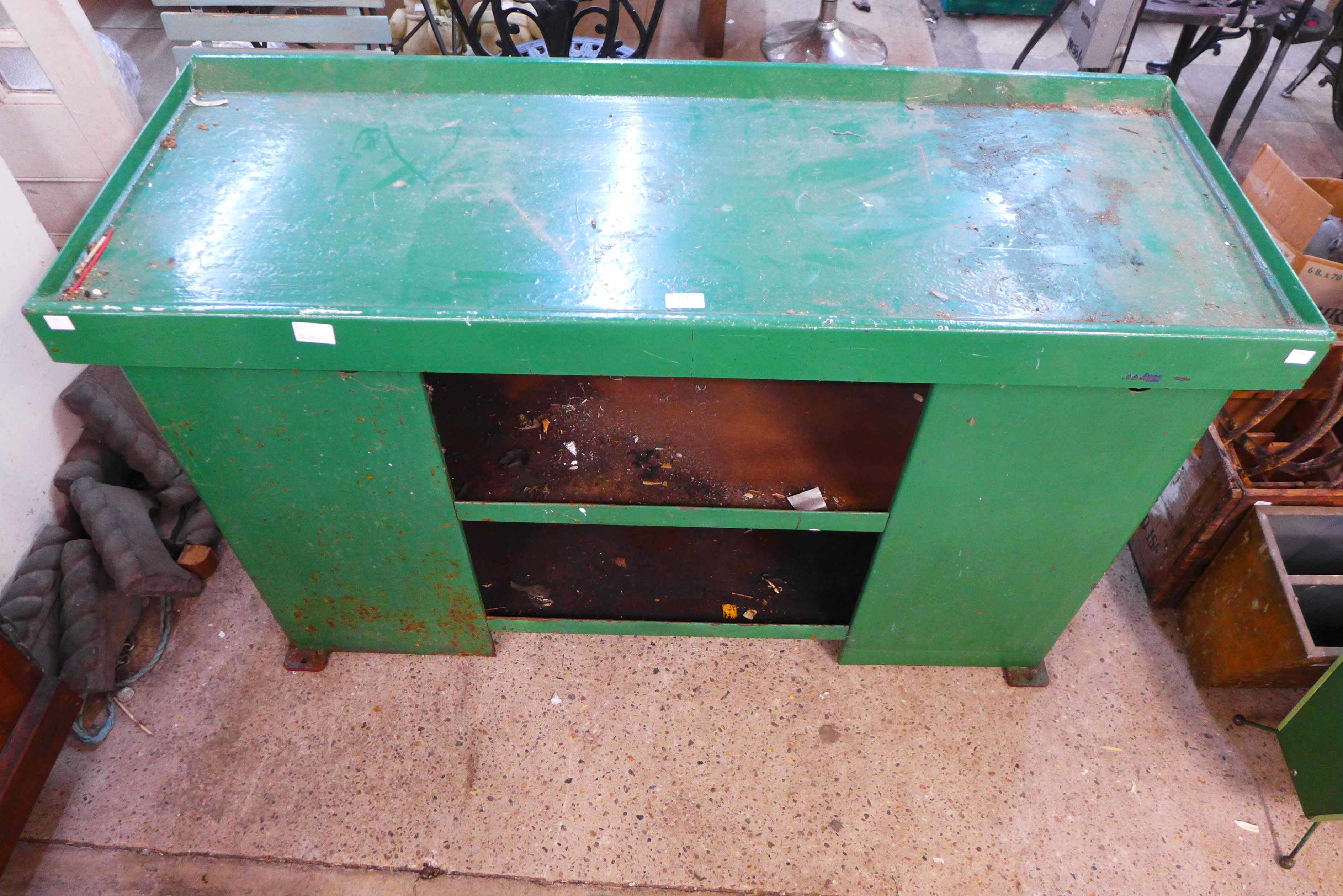 A green painted steel industrial cabinet
