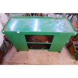 A green painted steel industrial cabinet