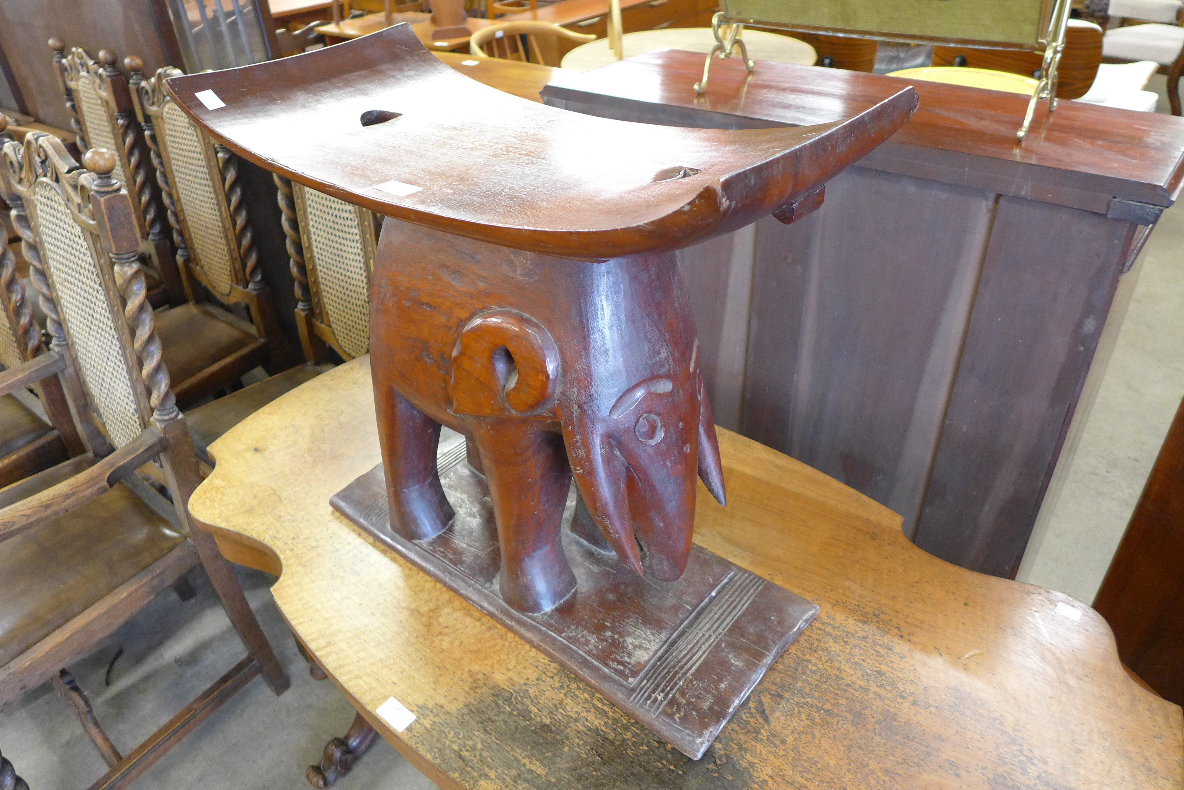 An African tribal carved hardwood elephant stool